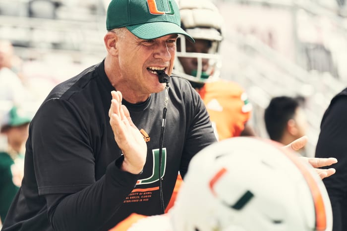 Mario Cristobal leads the Hurricanes in practice.